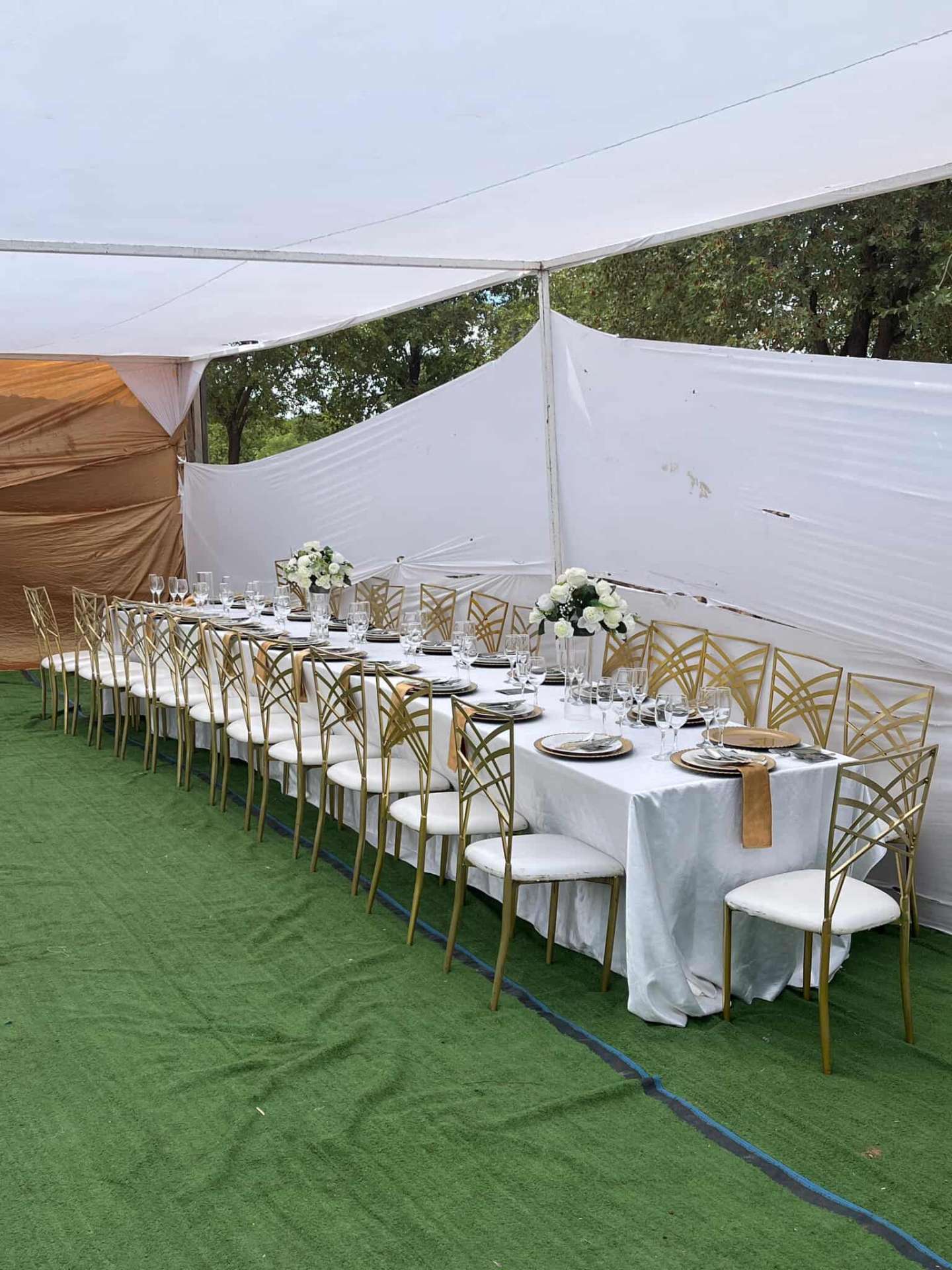 Cabana Wedding — Gold Chairs on Green